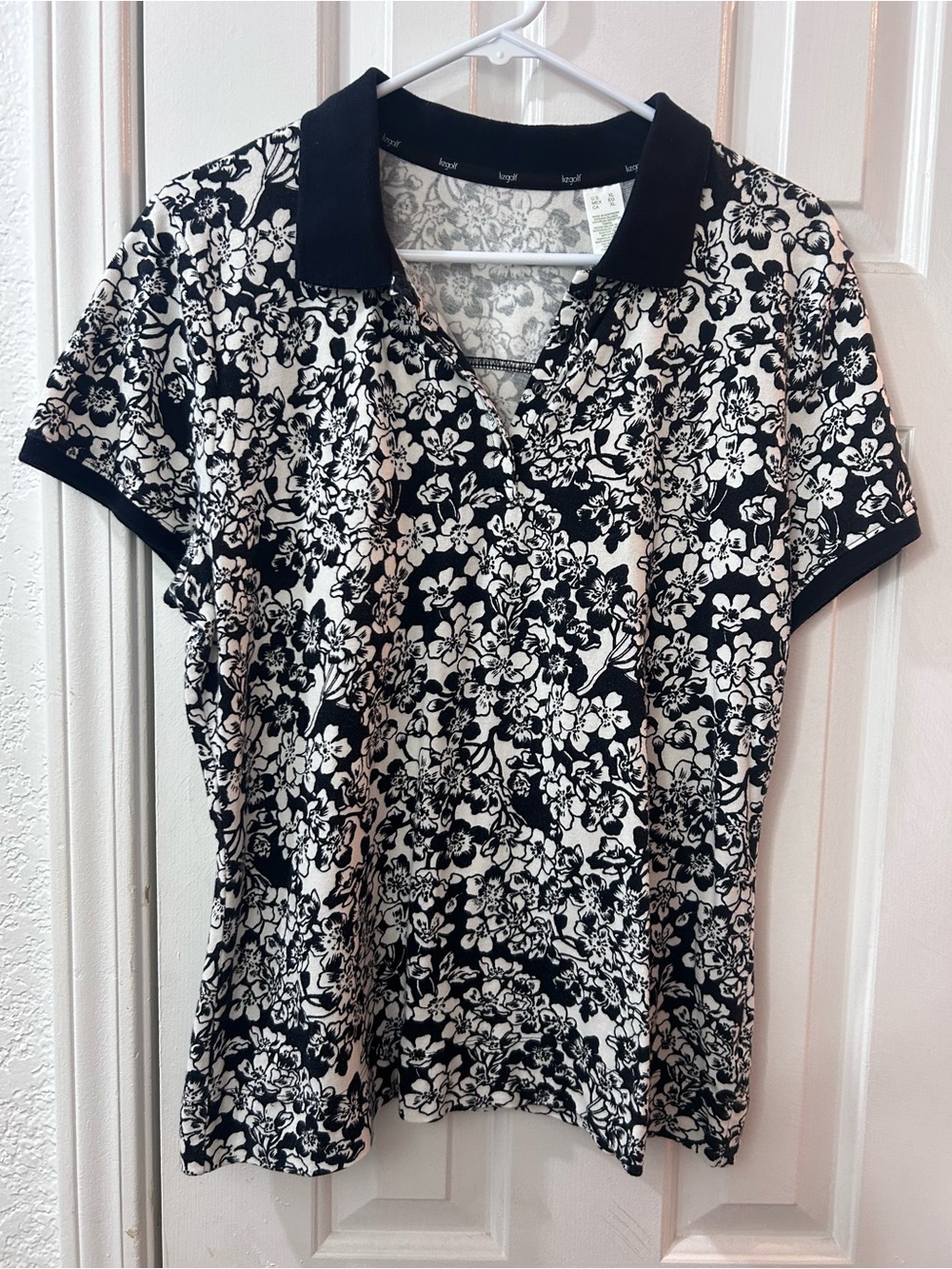 LizGolf black and white floral golf polo